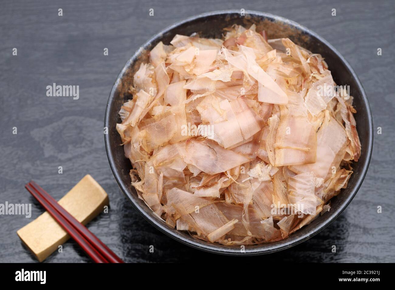 Japanese food, Katuobushi on cooked rice on black background Stock Photo