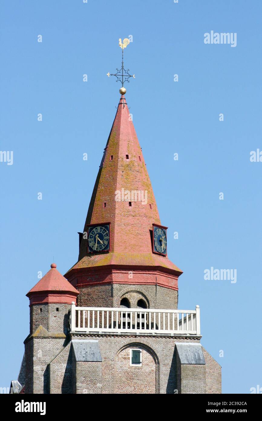 Red Tower with blue sky in the background Stock Photo