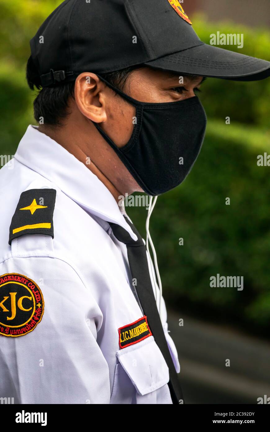Security guard wearing face mask during Covid 19 pandemic, Bangkok