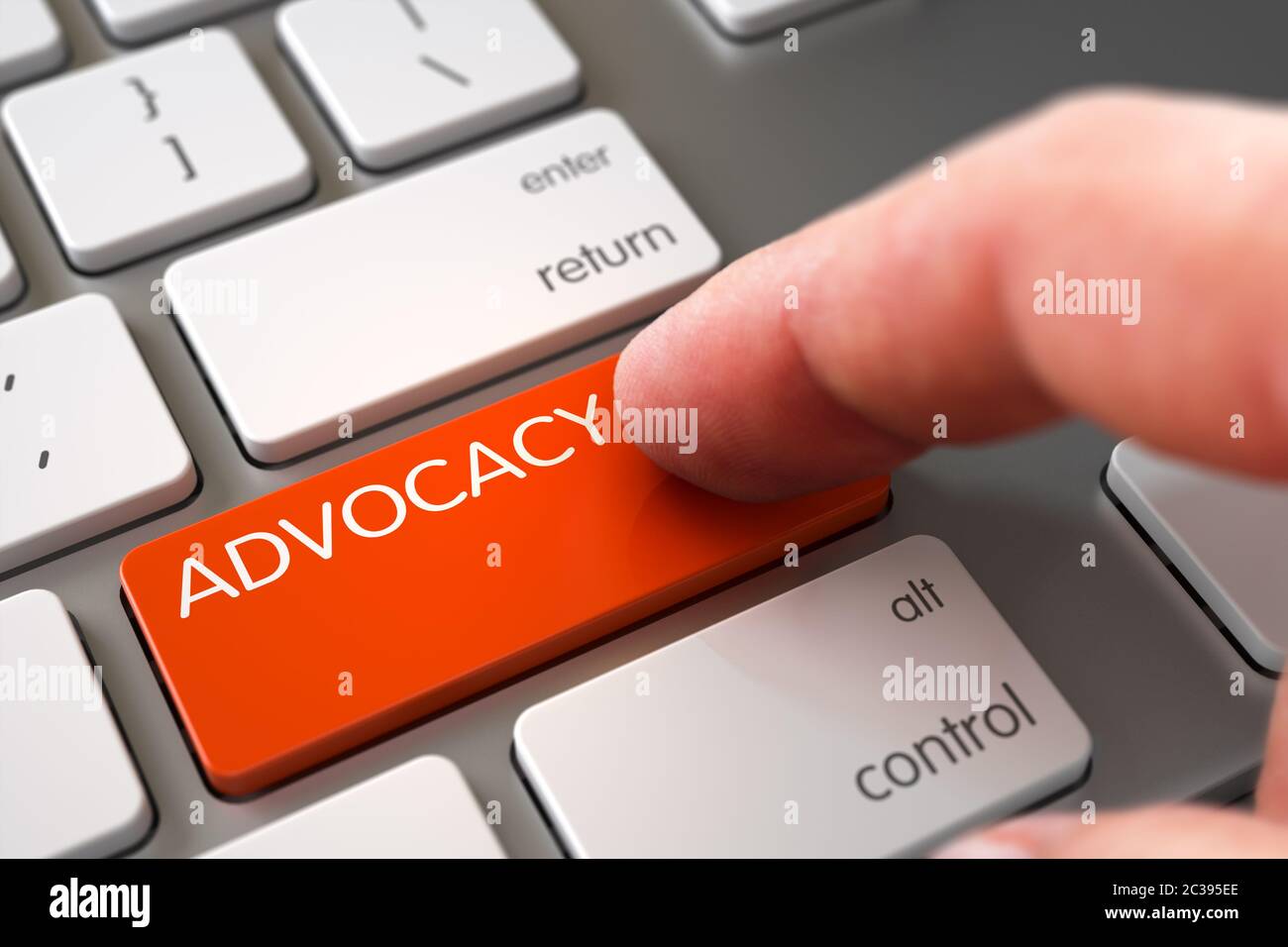 Finger Pushing Advocacy Key on Modernized Keyboard. Hand using Aluminum Keyboard with Advocacy Orange Button, Finger, Laptop. Advocacy Concept - Slim Stock Photo