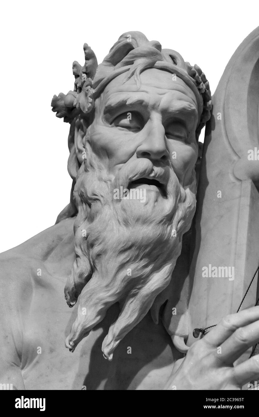 Head and shoulders detail of the ancient man with beard sculpture. Antique face with whiskers statue isolated on white backgroun Stock Photo