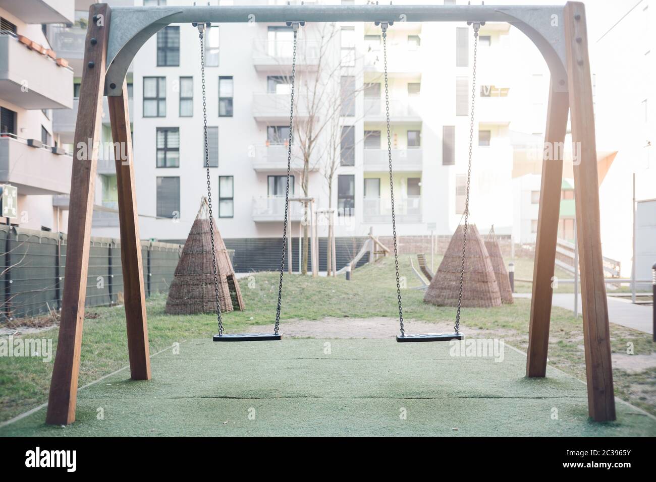 Swing set in a backyard. Childhood and youth memories concept. Stock Photo