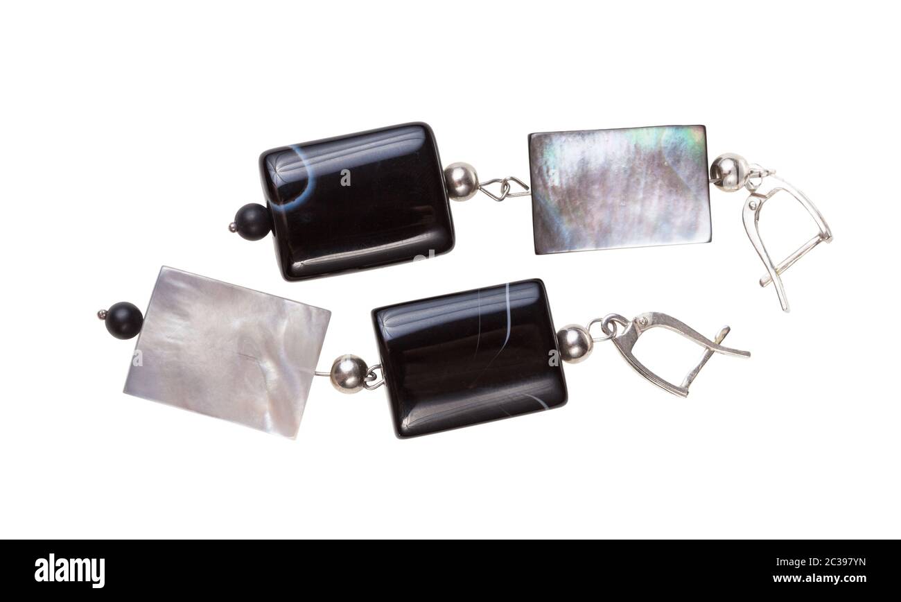 handmade silver earrings from polished agate and iridescent nacre beads isolated on white background Stock Photo