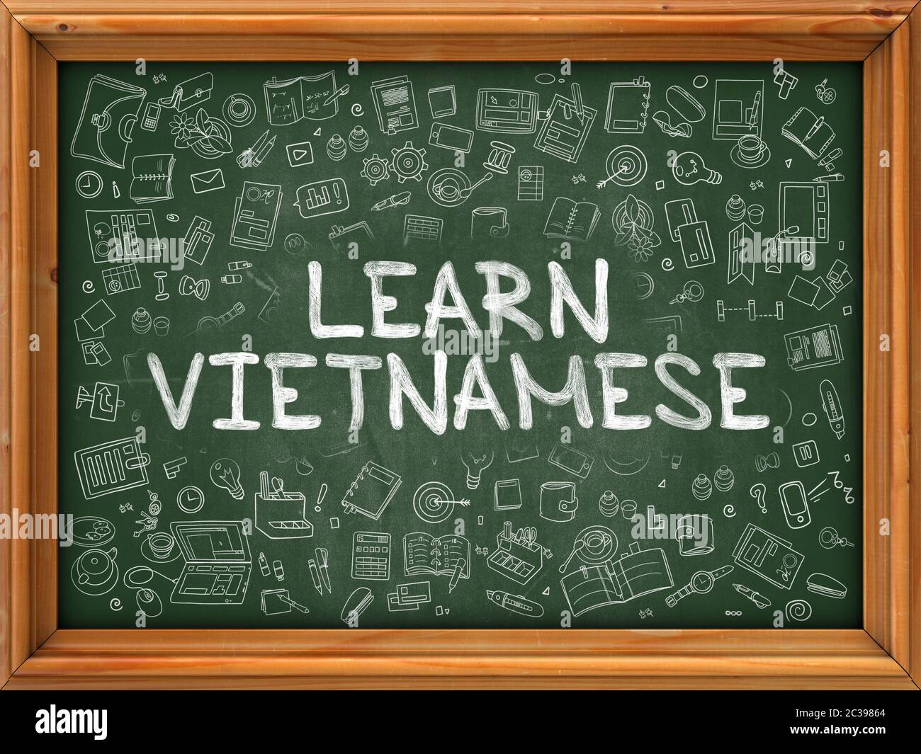 Learn Vietnamese - Hand Drawn on Green Chalkboard with Doodle Icons Around. Modern Illustration with Doodle Design Style. Stock Photo