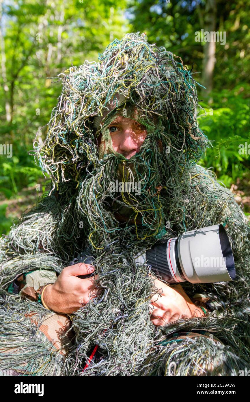 Selective Focus Photography of Man Wearing Camoflouge Suit While Holding a  Gun · Free Stock Photo