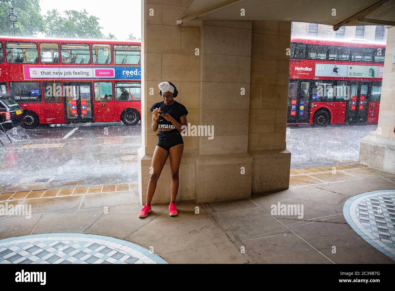 pic shows:  Flash storm in Traflagar Square led to flooding   Many caught in the rain whilst others sheltered     Picture by Gavin Rodgers/ Pixel8000 Stock Photo