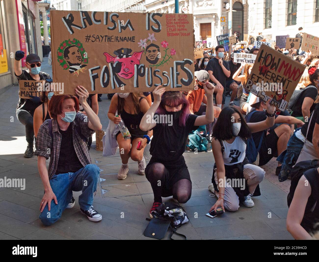 At a BLM rally in Brighton protesters take the knee Stock Photo - Alamy