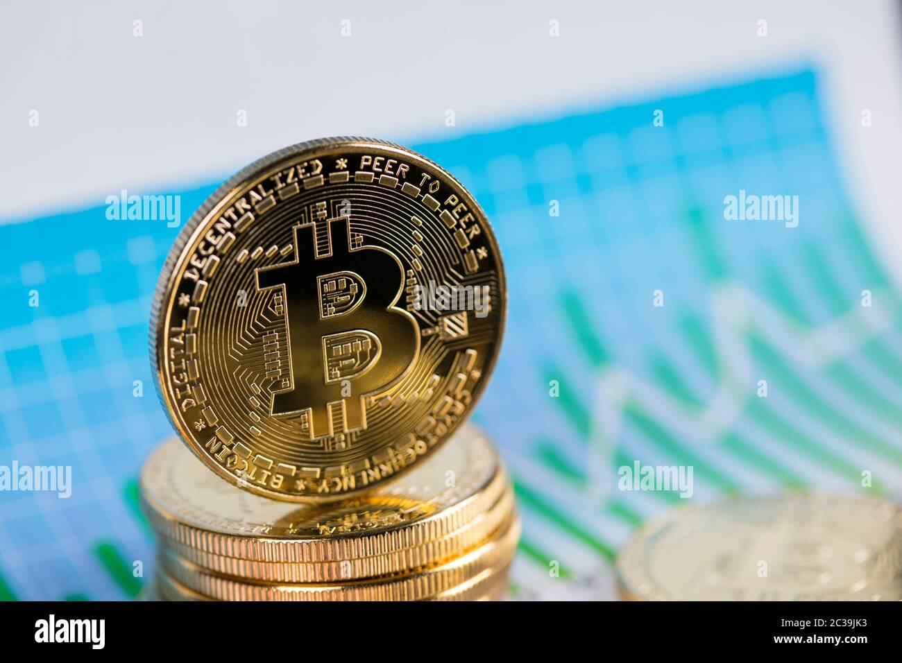 Gold Bitcoin on the background of the chart Stock Photo - Alamy
