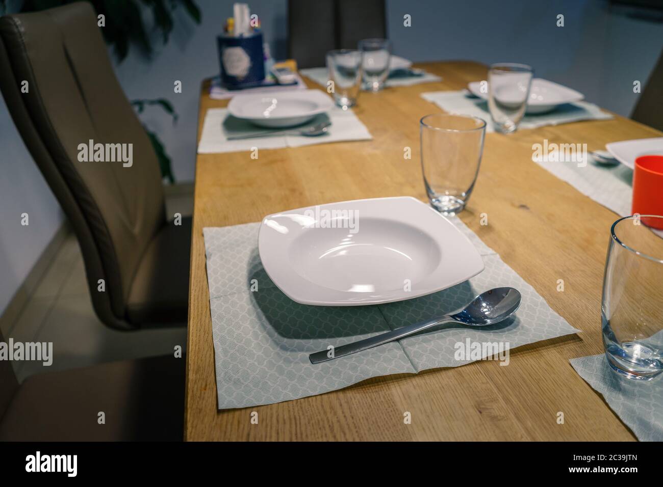 Table setting with Plate and Spoon Stock Photo Alamy