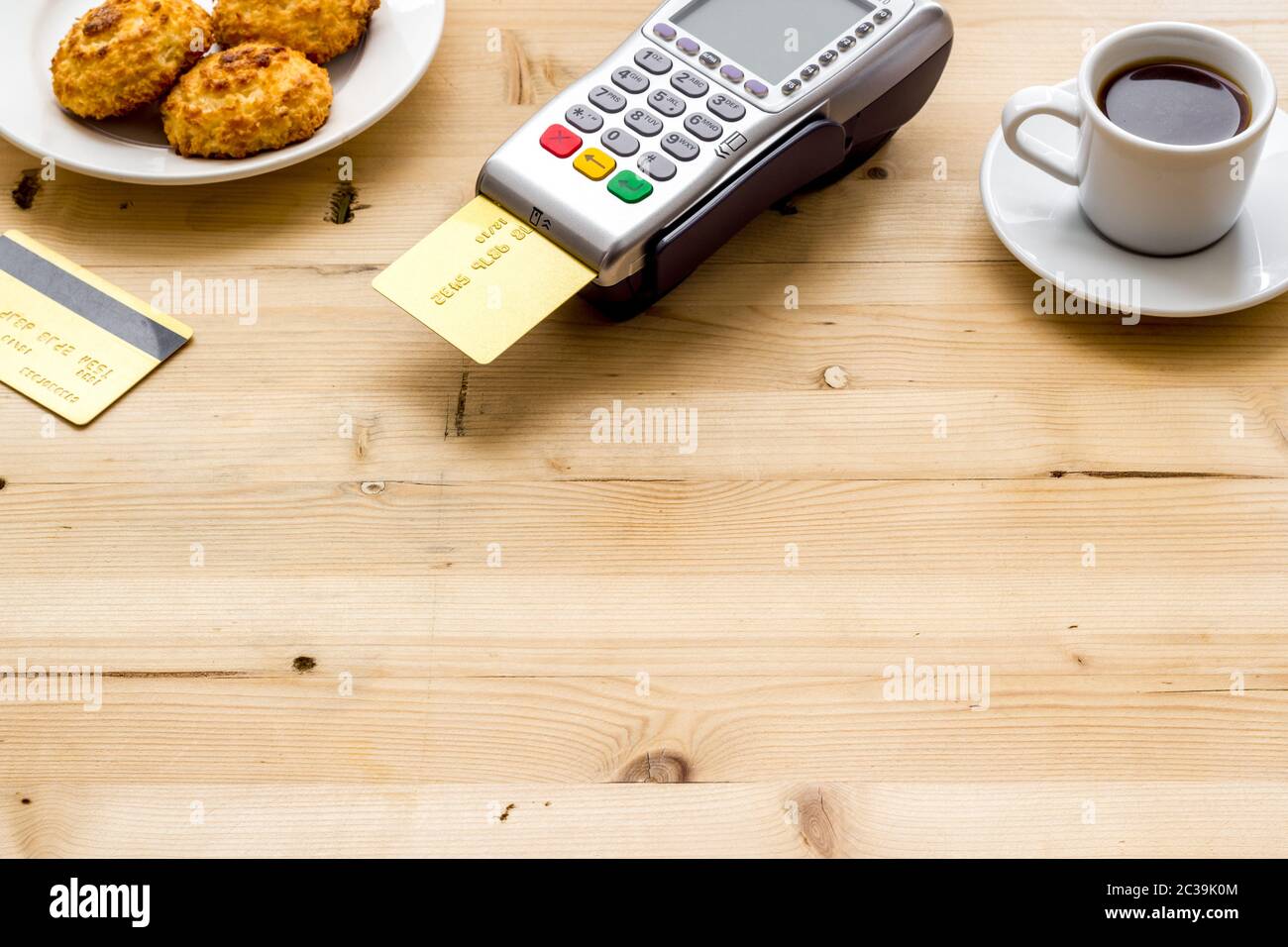 Payment transactions. Terminal and credit card on cafe wooden table ...