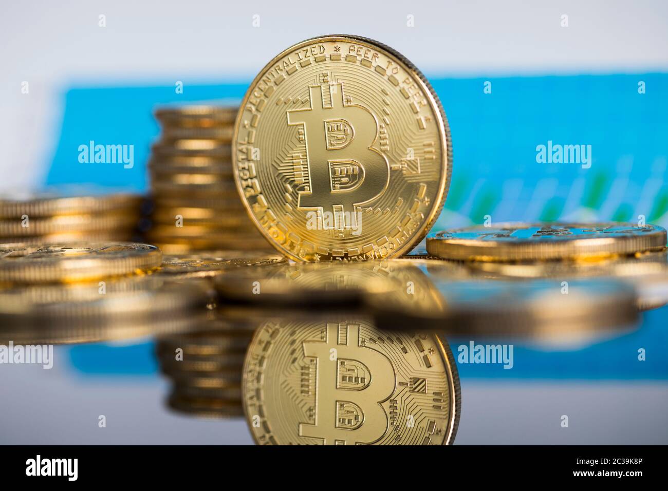 Gold Bitcoin on the background of the chart Stock Photo - Alamy