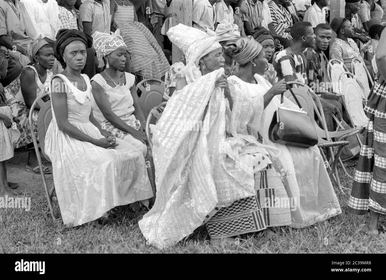 Festively dressed women and men at a festival in Sierra Leone. Stock Photo