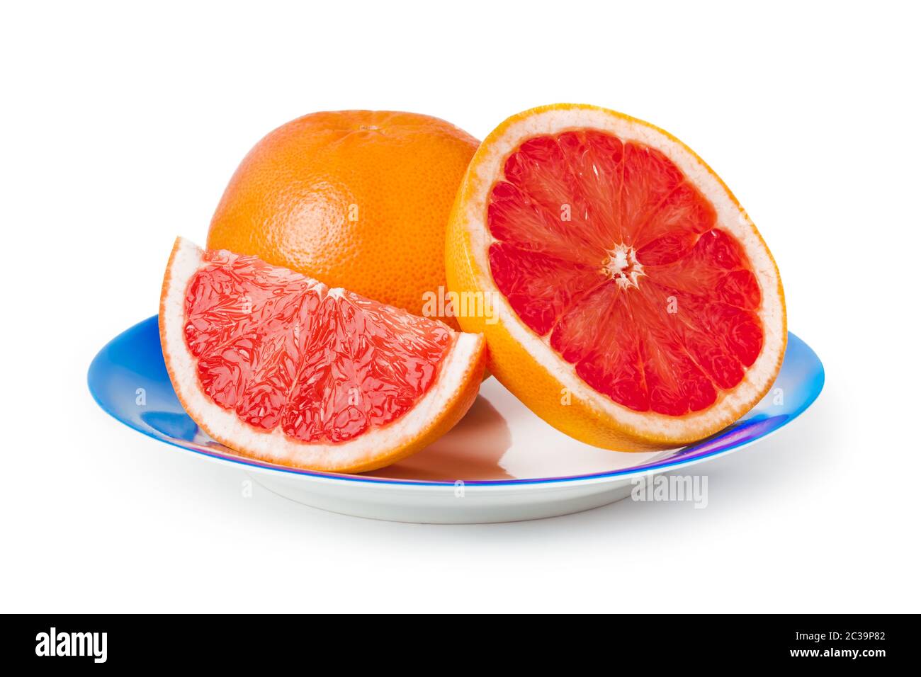 Ripe grapefruits on blue plate Stock Photo