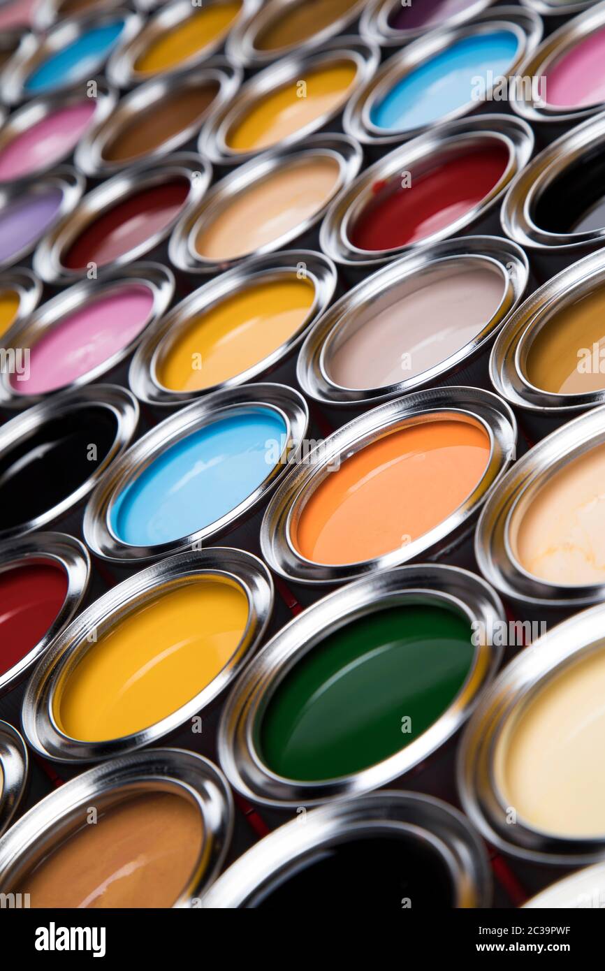 Group of tin metal cans with color paint Stock Photo - Alamy