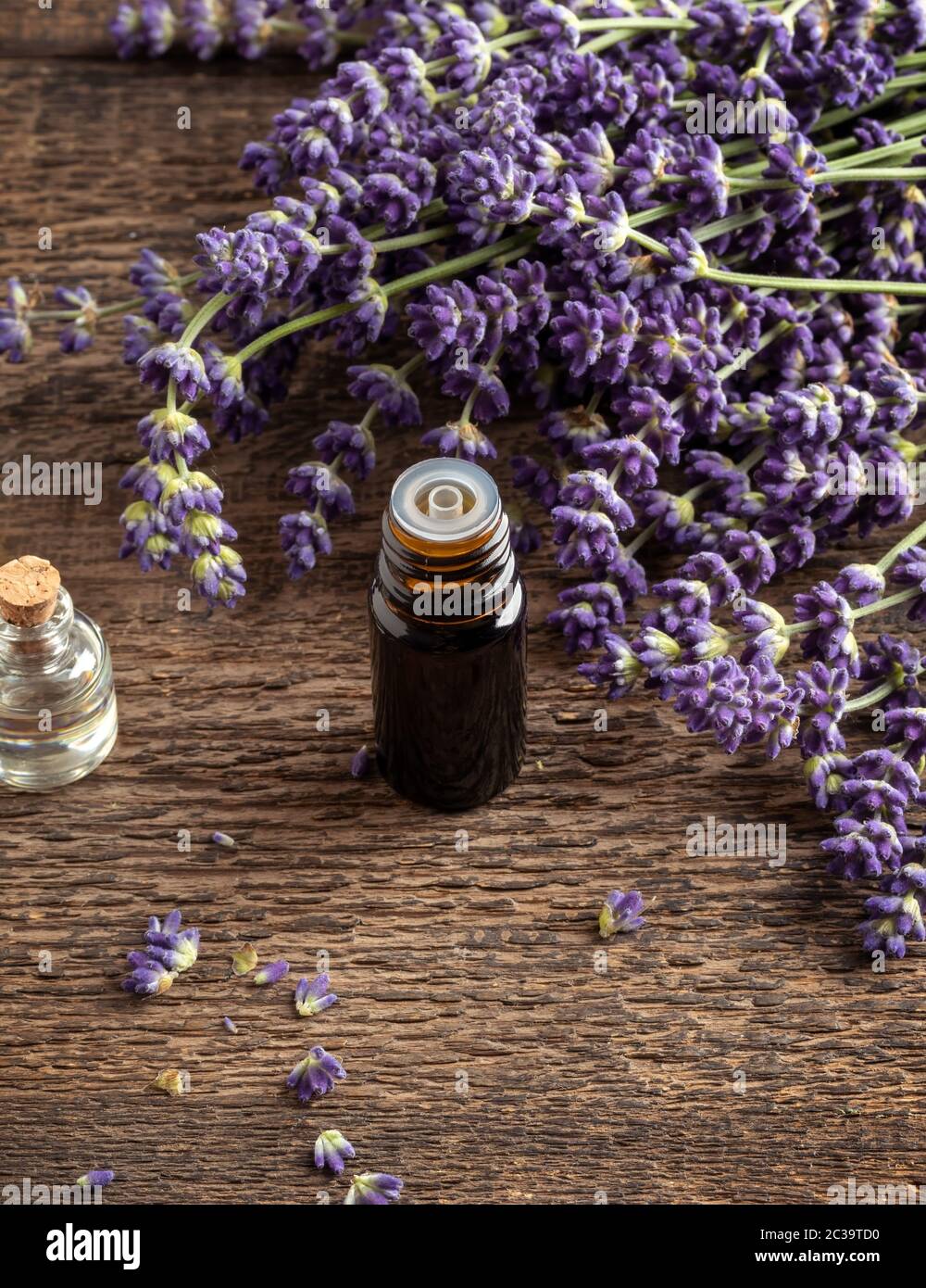 A bottle of essential oil with fresh blooming lavender twigs Stock ...