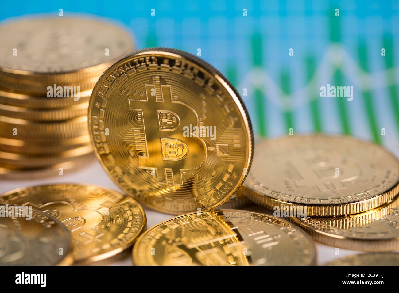 Gold Bitcoin on the background of the chart Stock Photo - Alamy