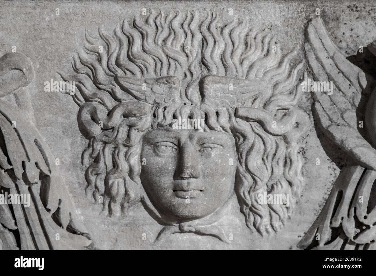 Medusa face sculpture. Head portrait of MedusaIn Greek mythology Medusa was a monster, a Gorgon, a winged human female with a hi Stock Photo