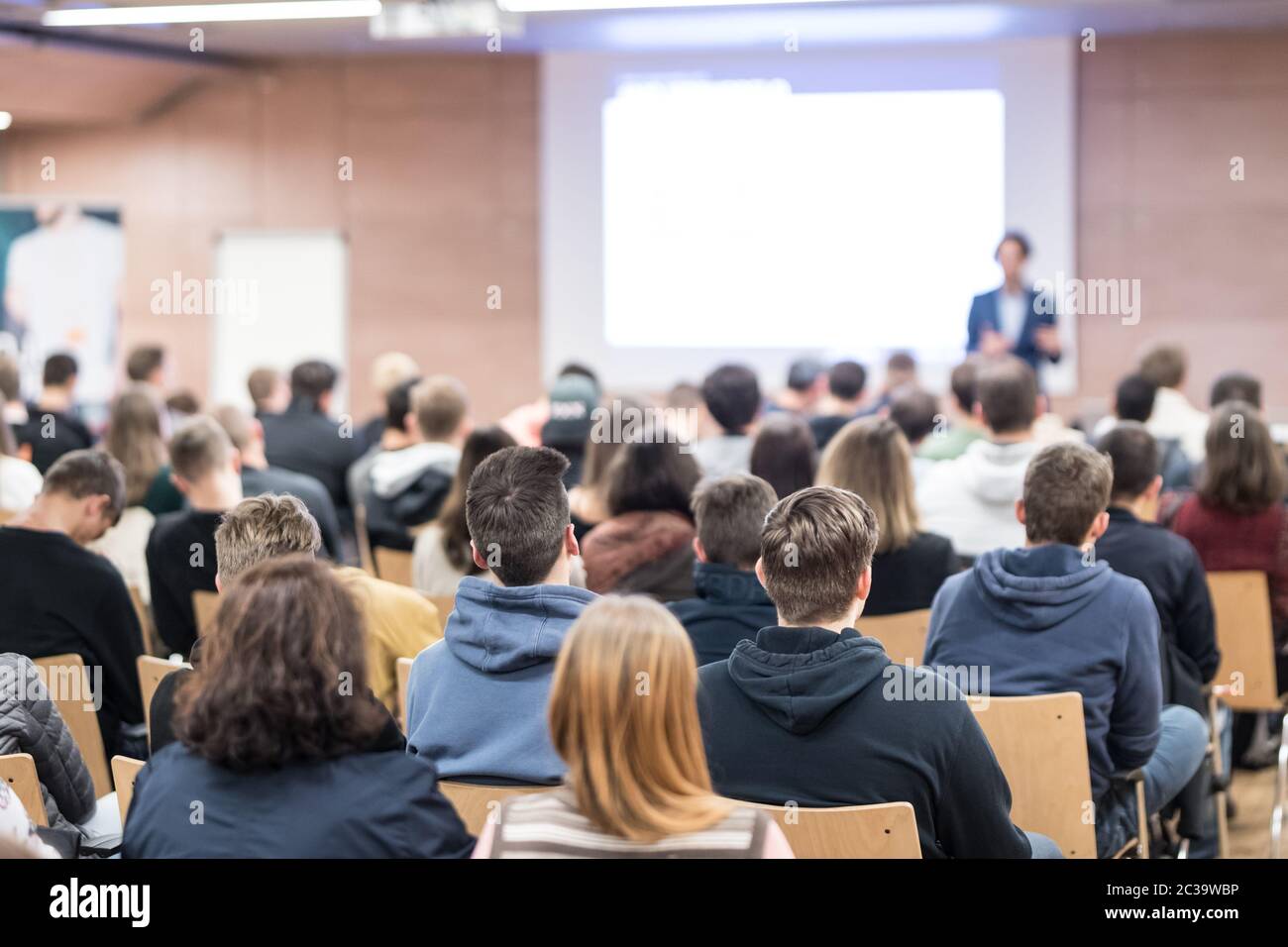 Speaker giving a talk in conference hall at business event. Audience at the conference hall. Business and Entrepreneurship concept. Focus on unrecogni Stock Photo