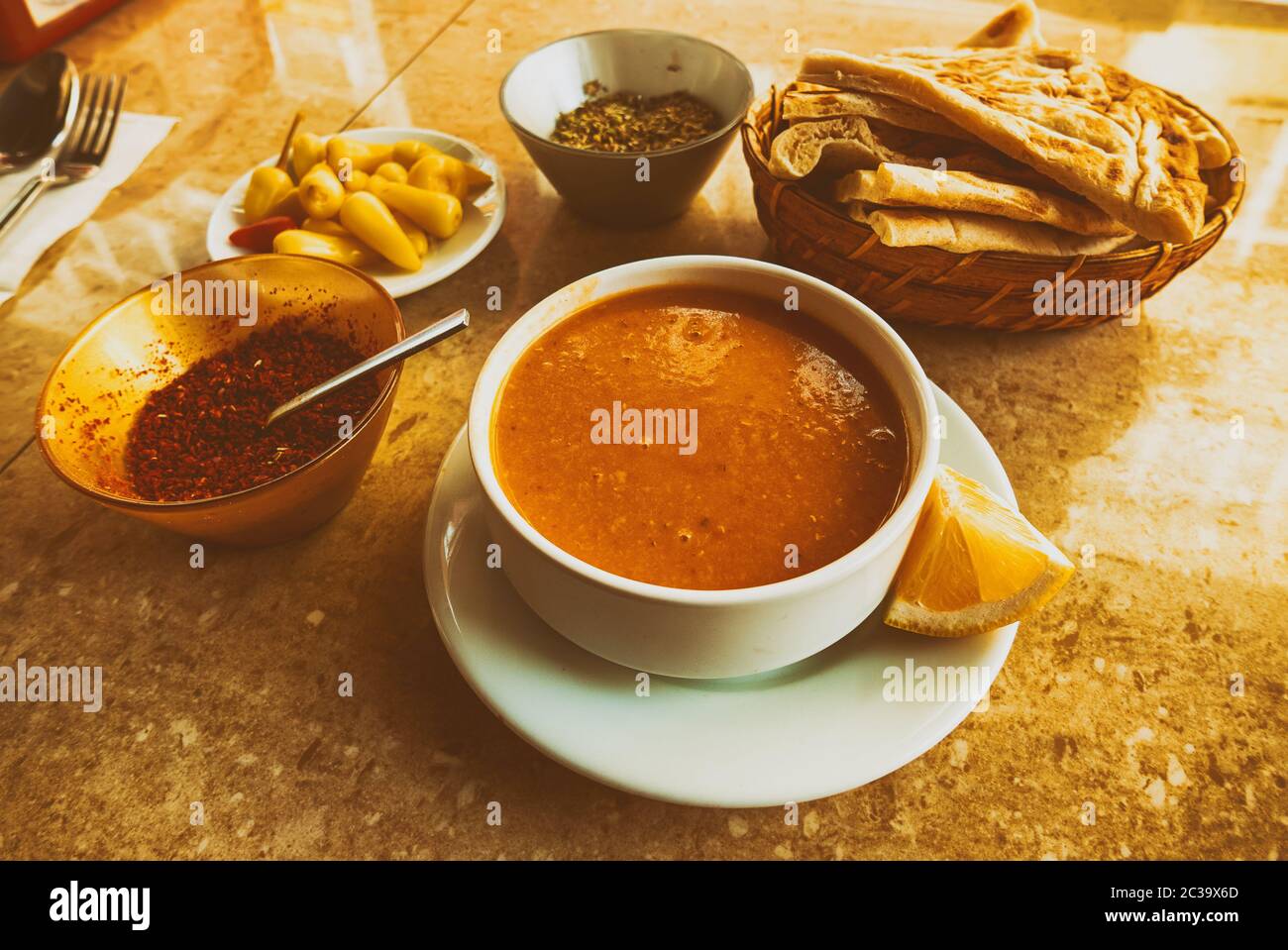Traditional Turkish Soup With Lentils On The Table With Bread And Spicy traditional-turkish-soup-with-lentils-on-the-table-with-bread-and-spicy