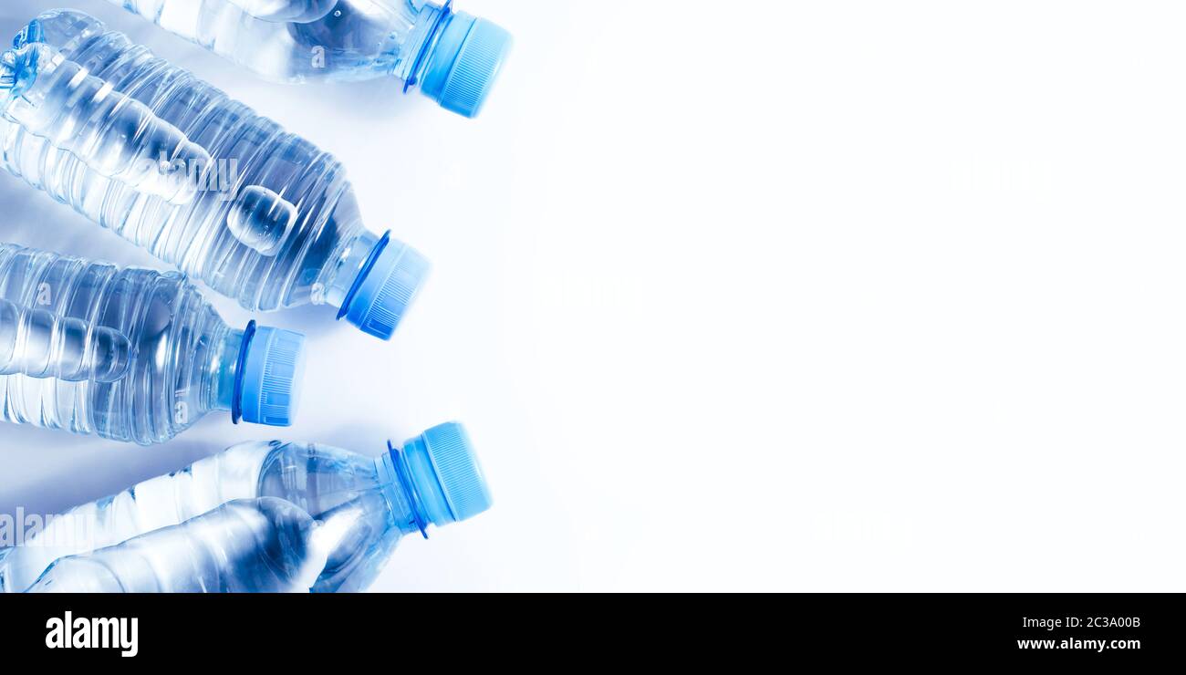 Several drinking water bottles on white background Stock Photo