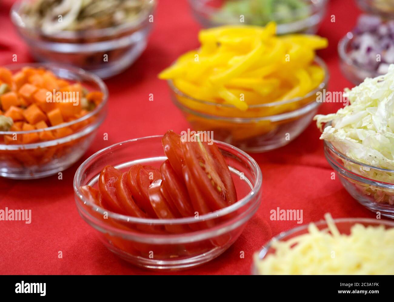 Different raw shredded vegetables and fruits as an example of a healthy