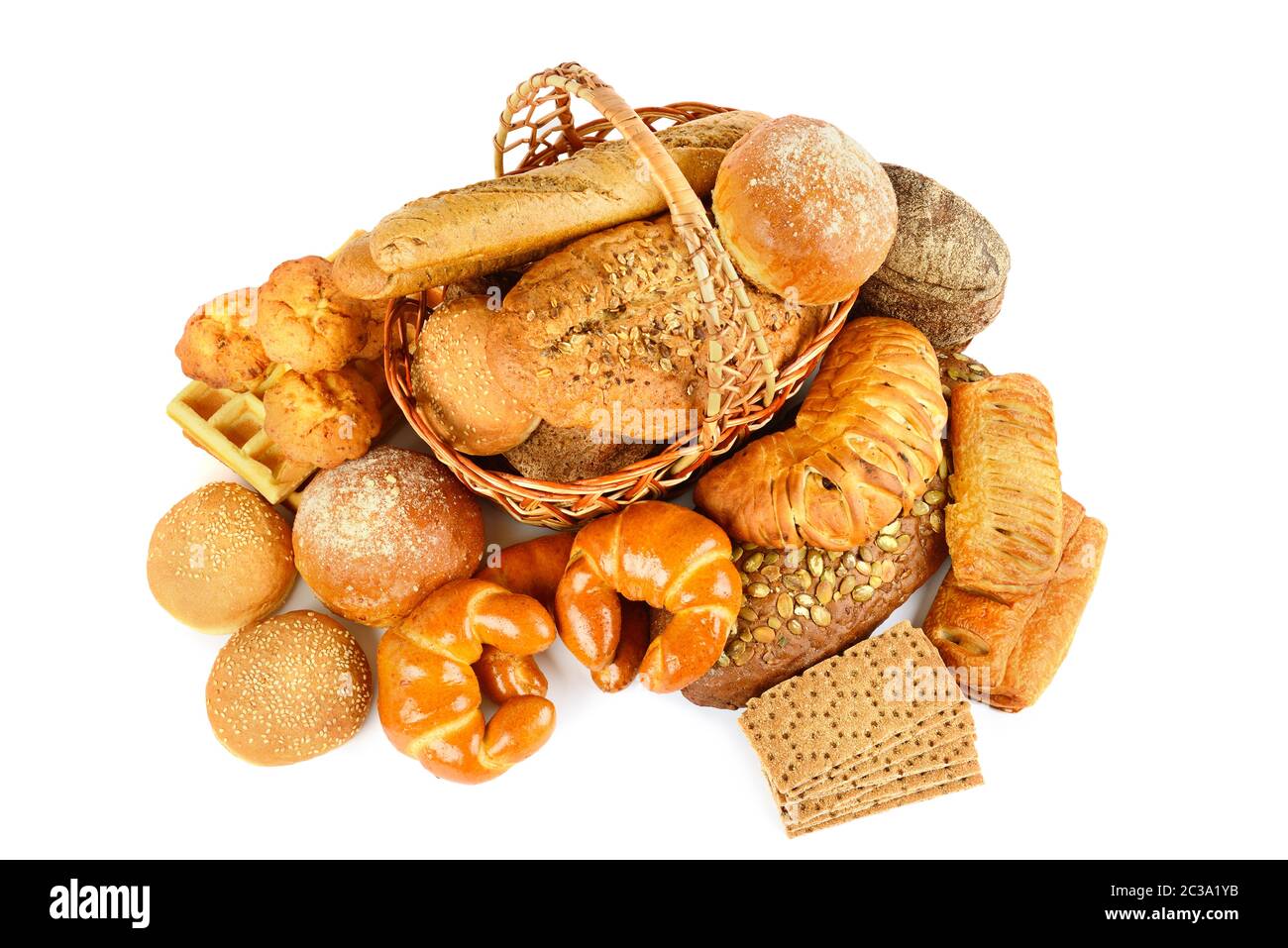 Black and white bread, croissants, buns and biscuits in a basket