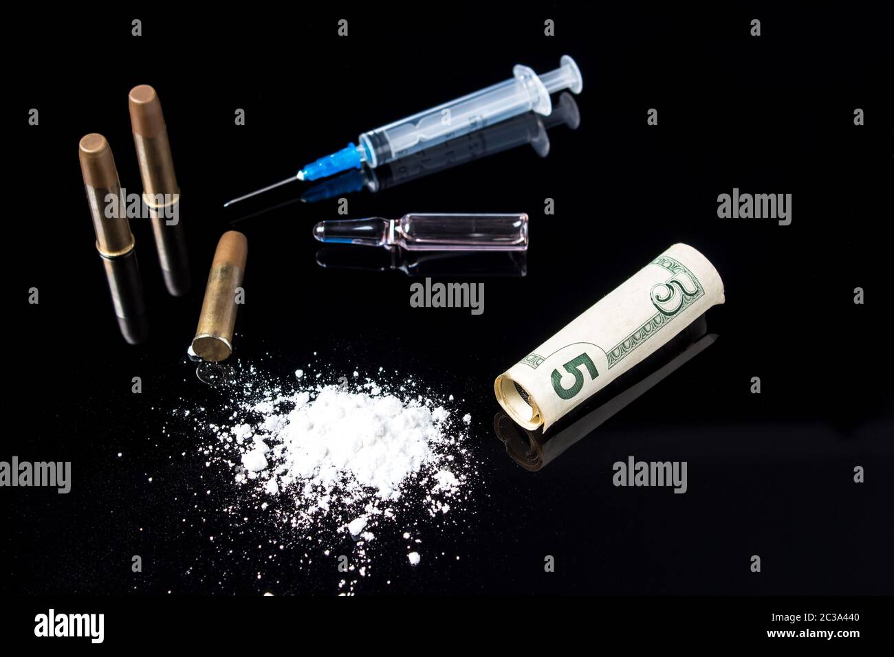 https://c8.alamy.com/comp/2C3A440/a-syringe-with-ampoules-white-powder-a-five-dollar-bill-with-bullets-lying-on-a-black-glass-background-dangerous-bad-habits-addiction-to-drugs-an-2C3A440.jpg