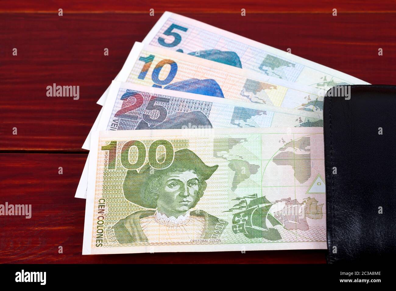 Money from El Salvador in the black wallet Stock Photo Alamy