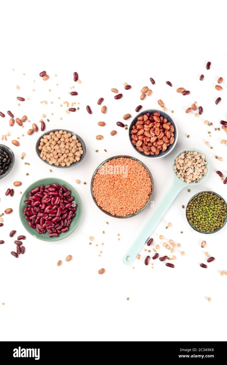 Legumes, overhead shot on a white background. Vibrant pulses including