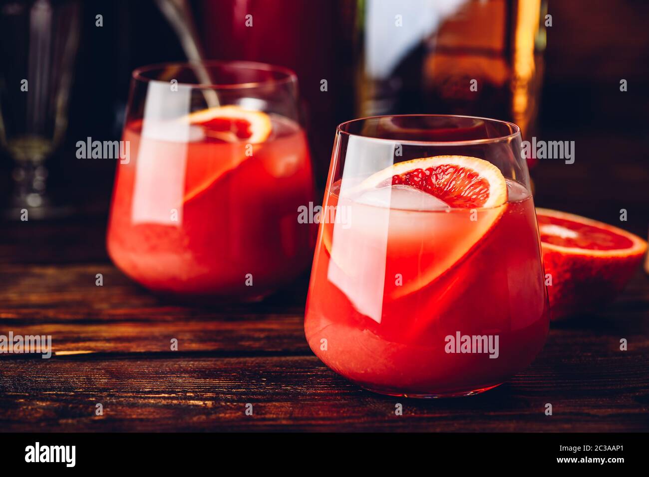 Whiskey sour cocktail with aged bourbon, blood orange juice and cherry