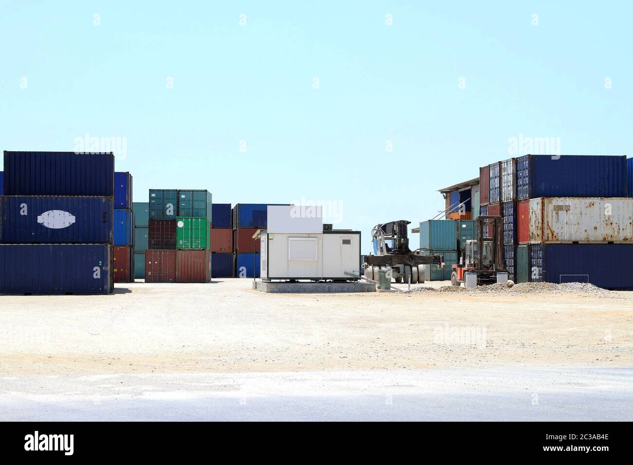 Shipping and cargo containers at distribution centre Stock Photo - Alamy