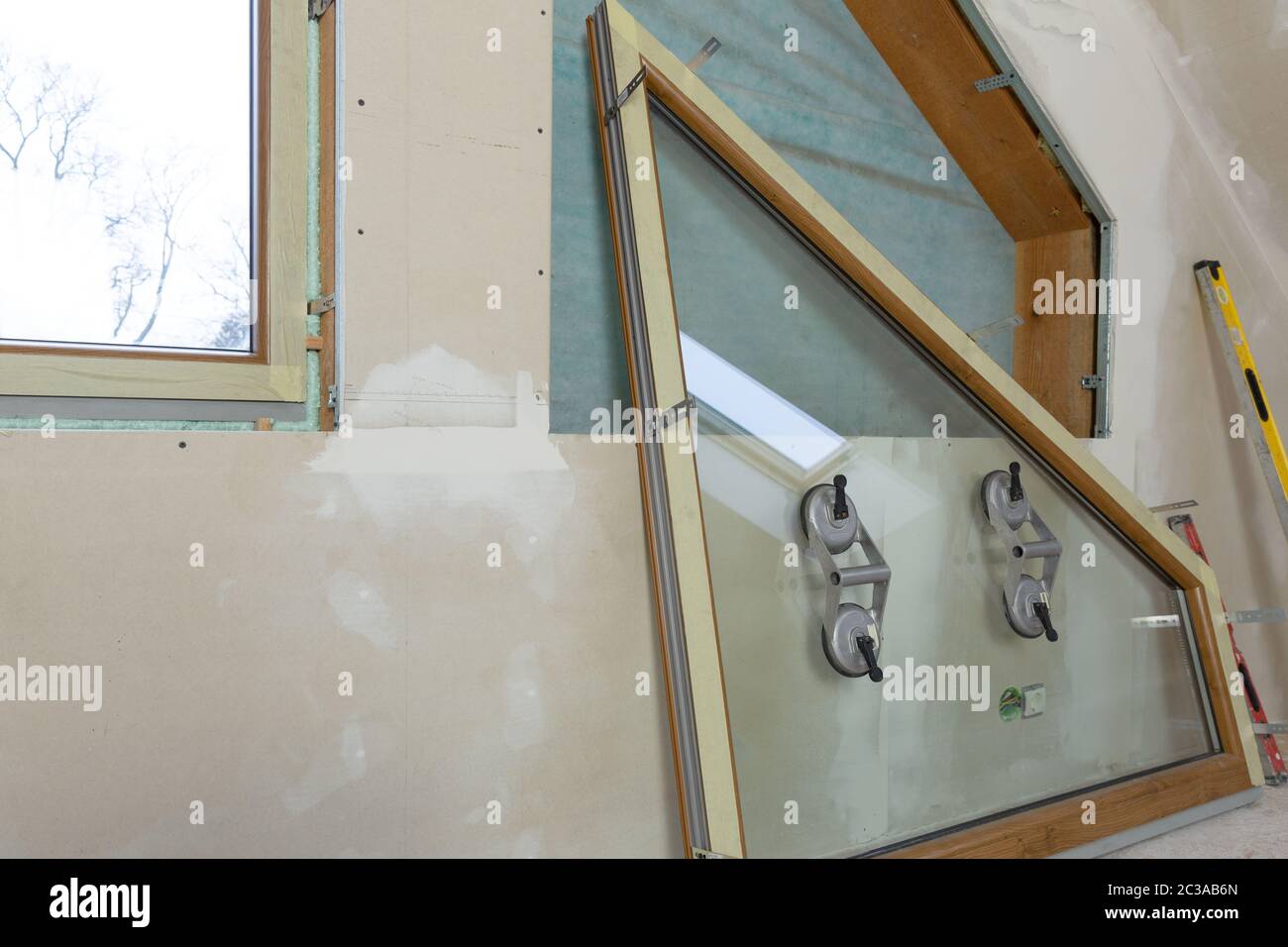 PVC window instalation in a new insulated and filled dry wall attic