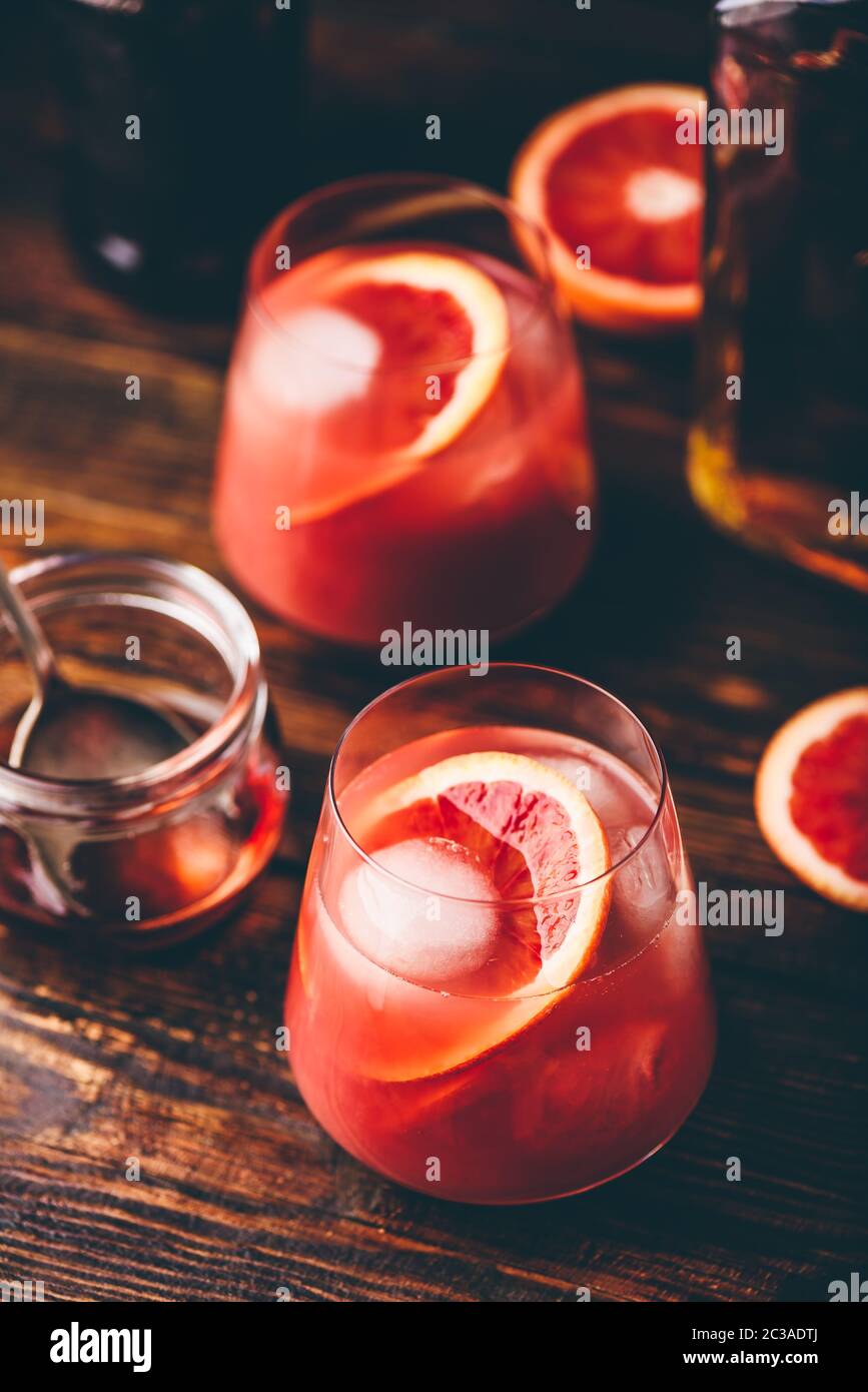 Whiskey sour cocktail with aged bourbon, blood orange juice and cherry