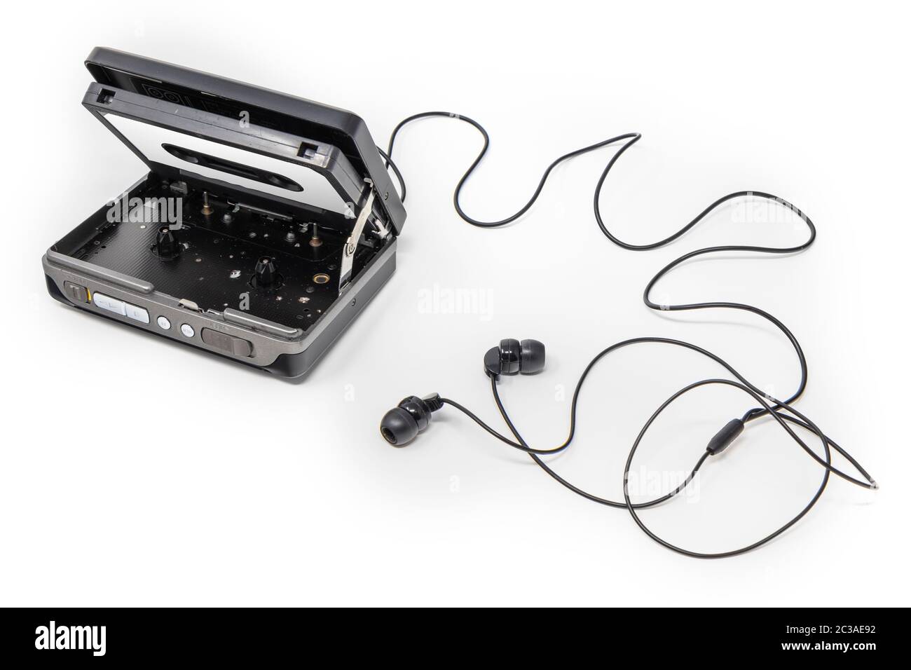 Vintage audio player. Old fashioned portable cassette player, cult object, icon and symbol of the 80s and 90s. Headphones isolated on white background Stock Photo