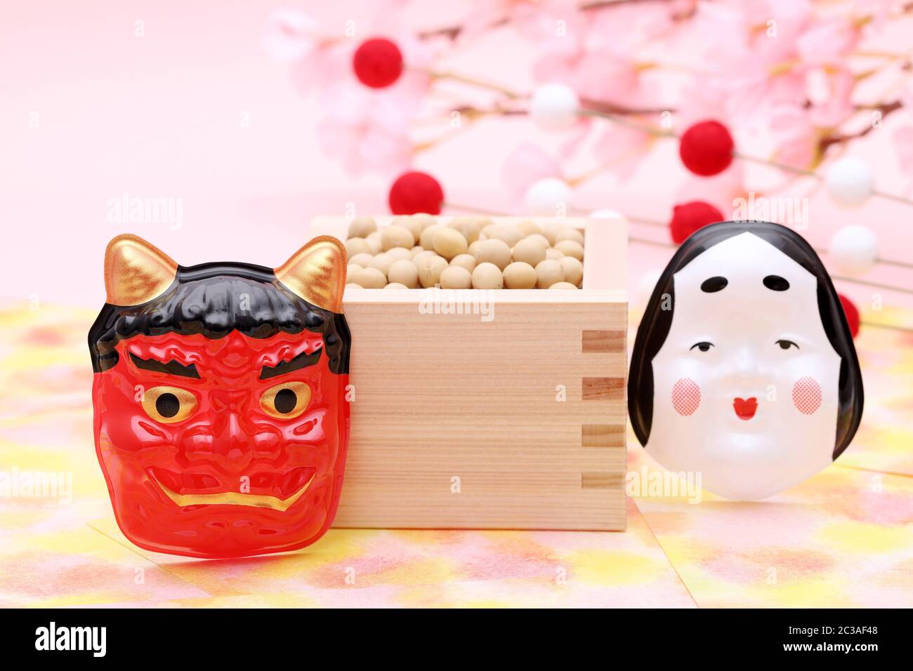 Japanese traditional Setsubun event, Soybeans and masks of demon and otafuku are used on an annual event Stock Photo