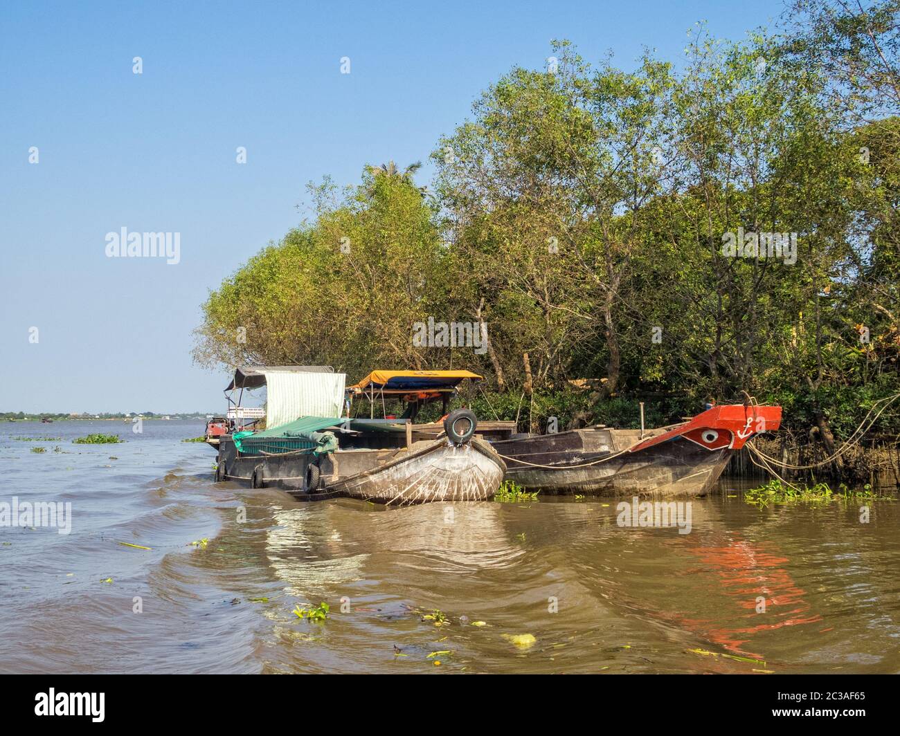Traditional Mekong Delta freight boats - Vinh Long, Vietnam Stock Photo