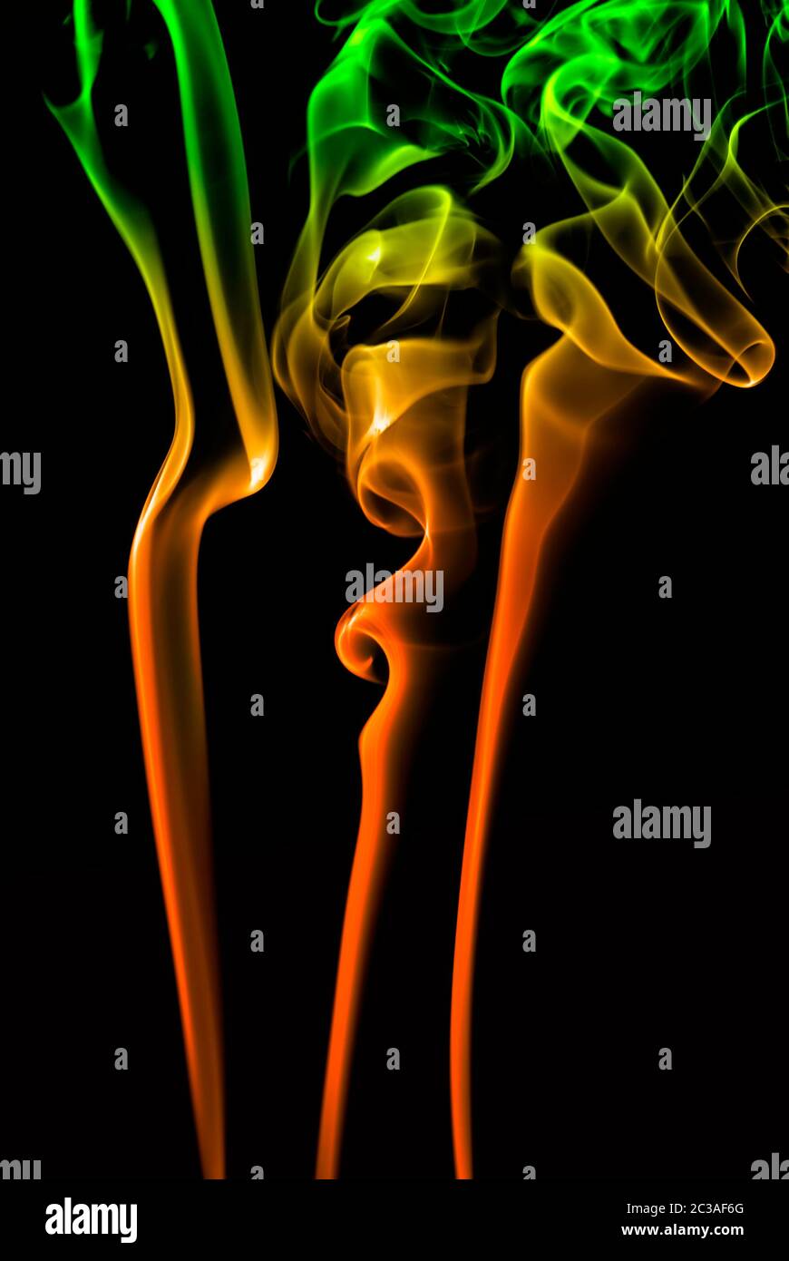 abstract colored smoke in a black background Stock Photo - Alamy