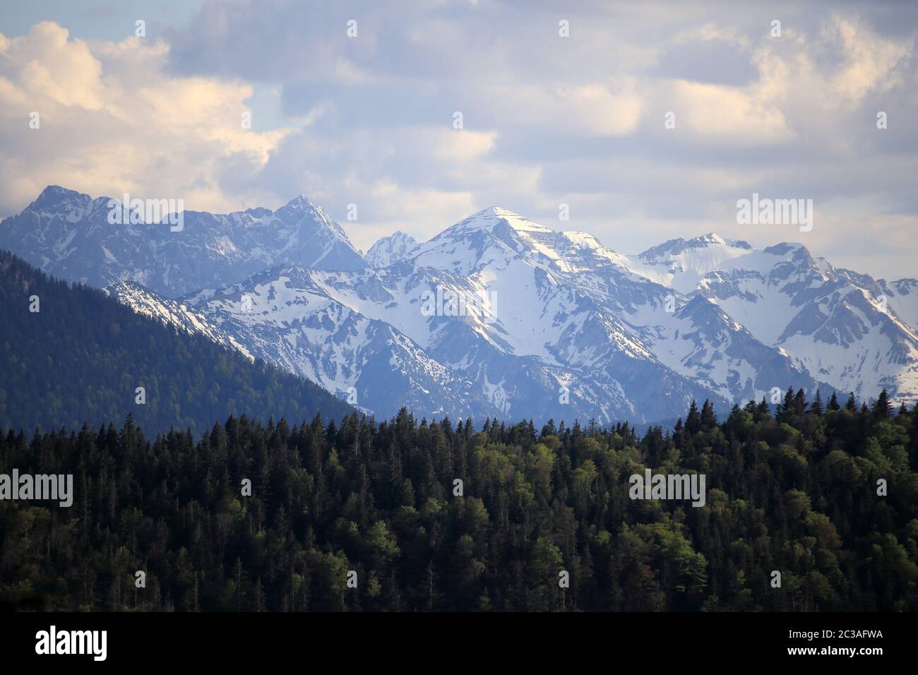 some snowy mountain peaks in bavarian landscape Stock Photo