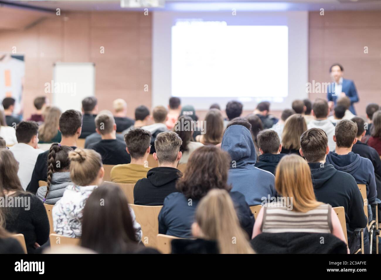 Speaker giving a talk in conference hall at business event. Audience at the conference hall. Business and Entrepreneurship concept. Focus on unrecogni Stock Photo