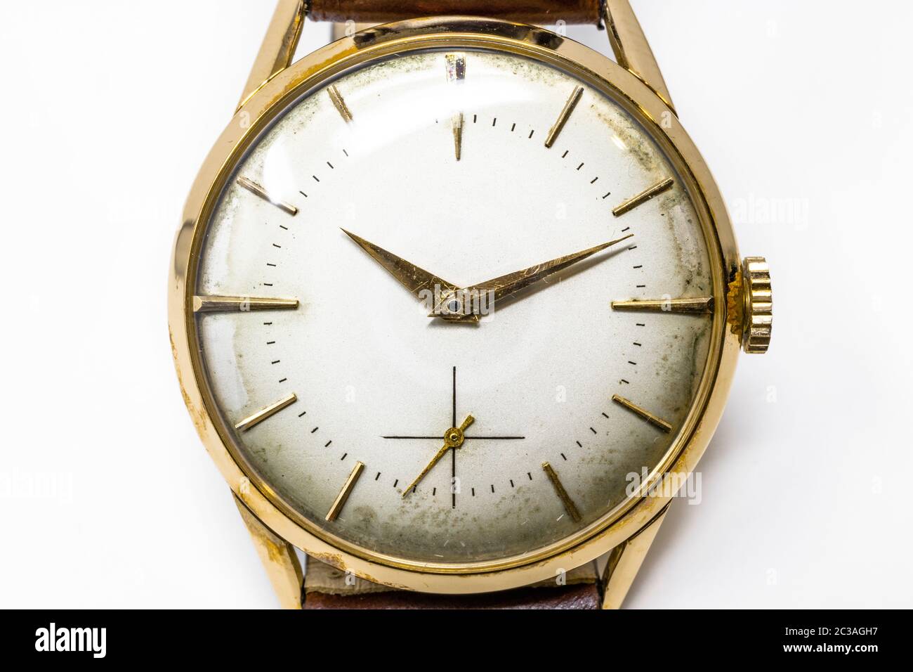 An old gold mechanical wristwatch with manual winding. Antique watch