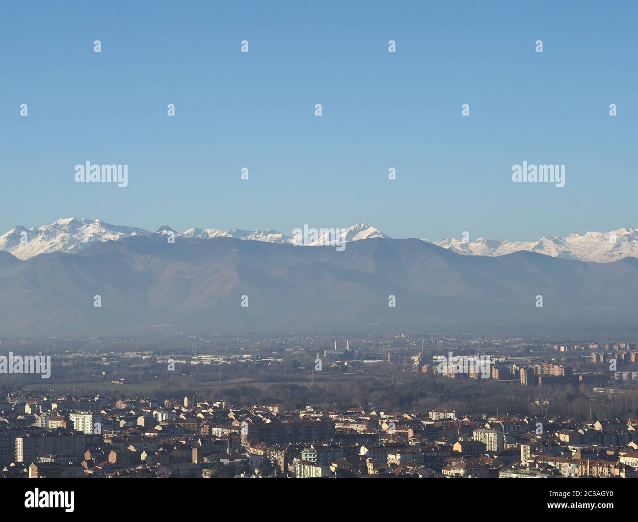 Aerial view of the city of Turin, Italy with Alps mountain range in the ...