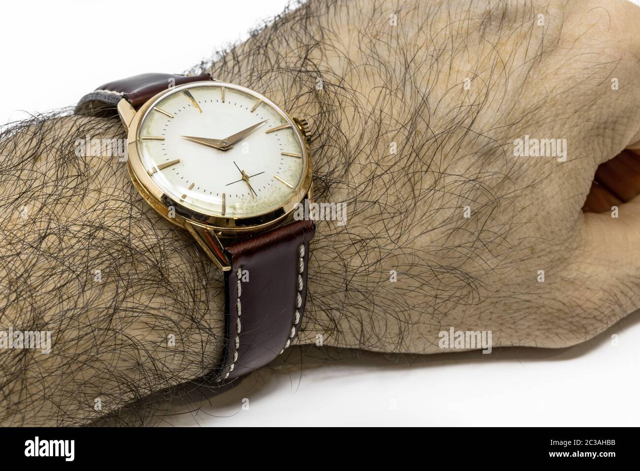 An old gold mechanical wristwatch with manual winding. Antique 