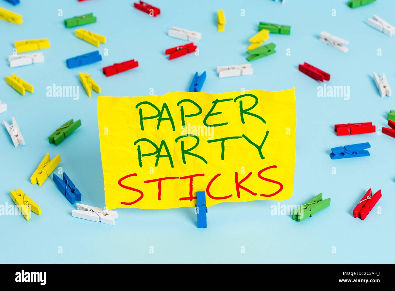 Handwriting text writing Paper Party Sticks. Conceptual photo hard painted paper shaped used for signs and emoji Colored clothespin papers empty remin Stock Photo