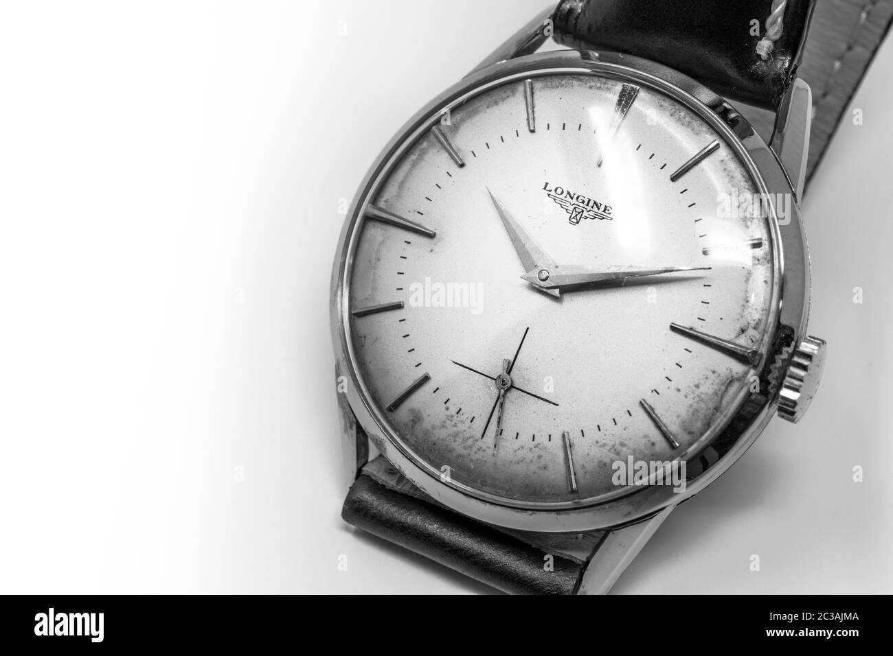 November 5, 2019 - Rome, Italy - An old Longines gold mechanical wristwatch with manual winding. Antique watch ruined by time, with scratches and mild Stock Photo