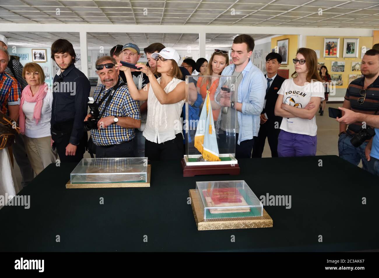 Panmunjom, North Korea - May 5, 2019: Tourist from different countries inside the North Korea Peace Museum in Joint Security Area. The demilitarized z Stock Photo