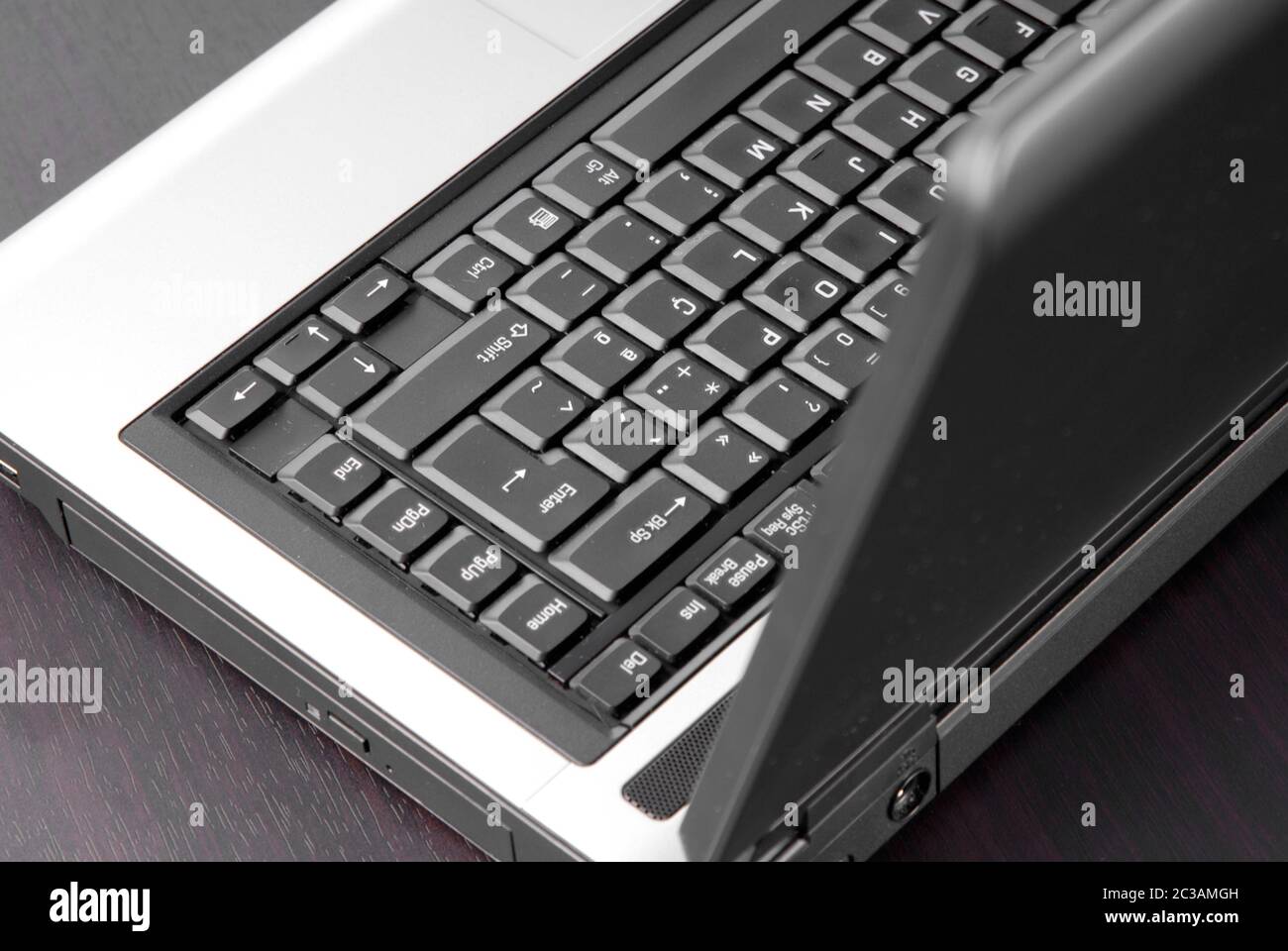 laptop keyboard detail in a black table Stock Photo - Alamy