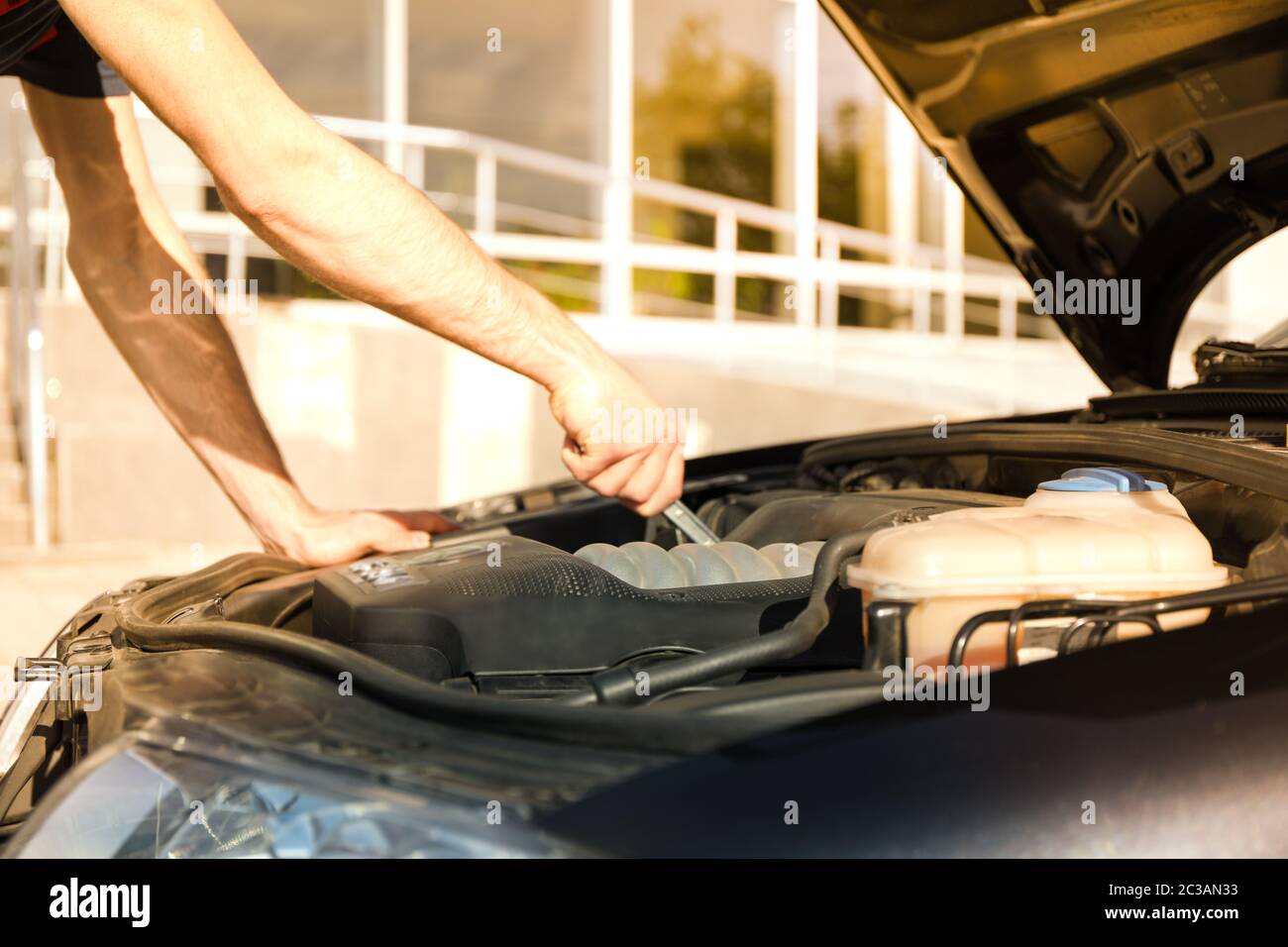 Man fixing engine. Car inspection. Work of mechanic Stock Photo Alamy