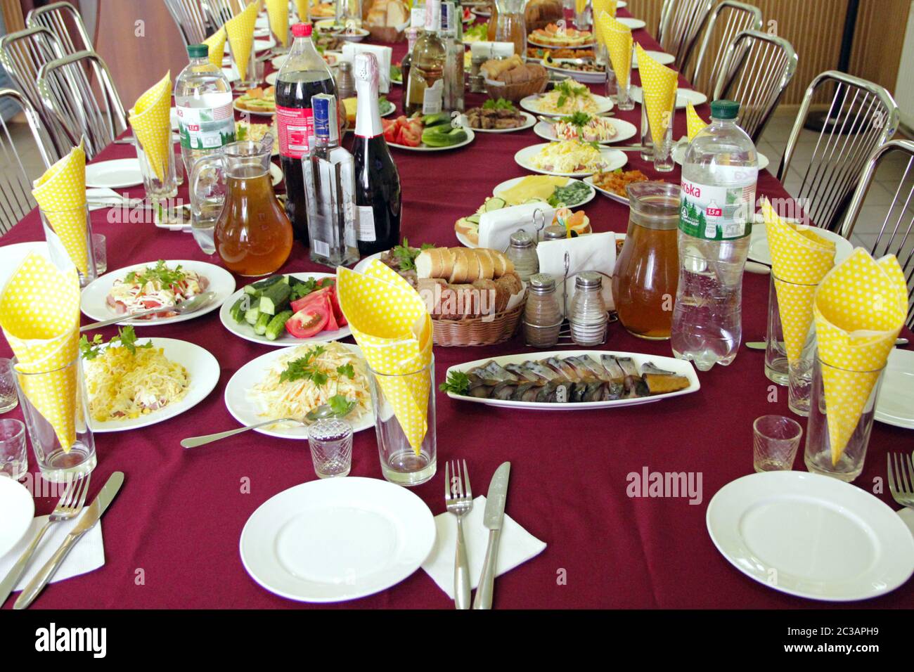 Festive table with delicious dishes. Many food on table for family holiday. Banquet table with delic Stock Photo
