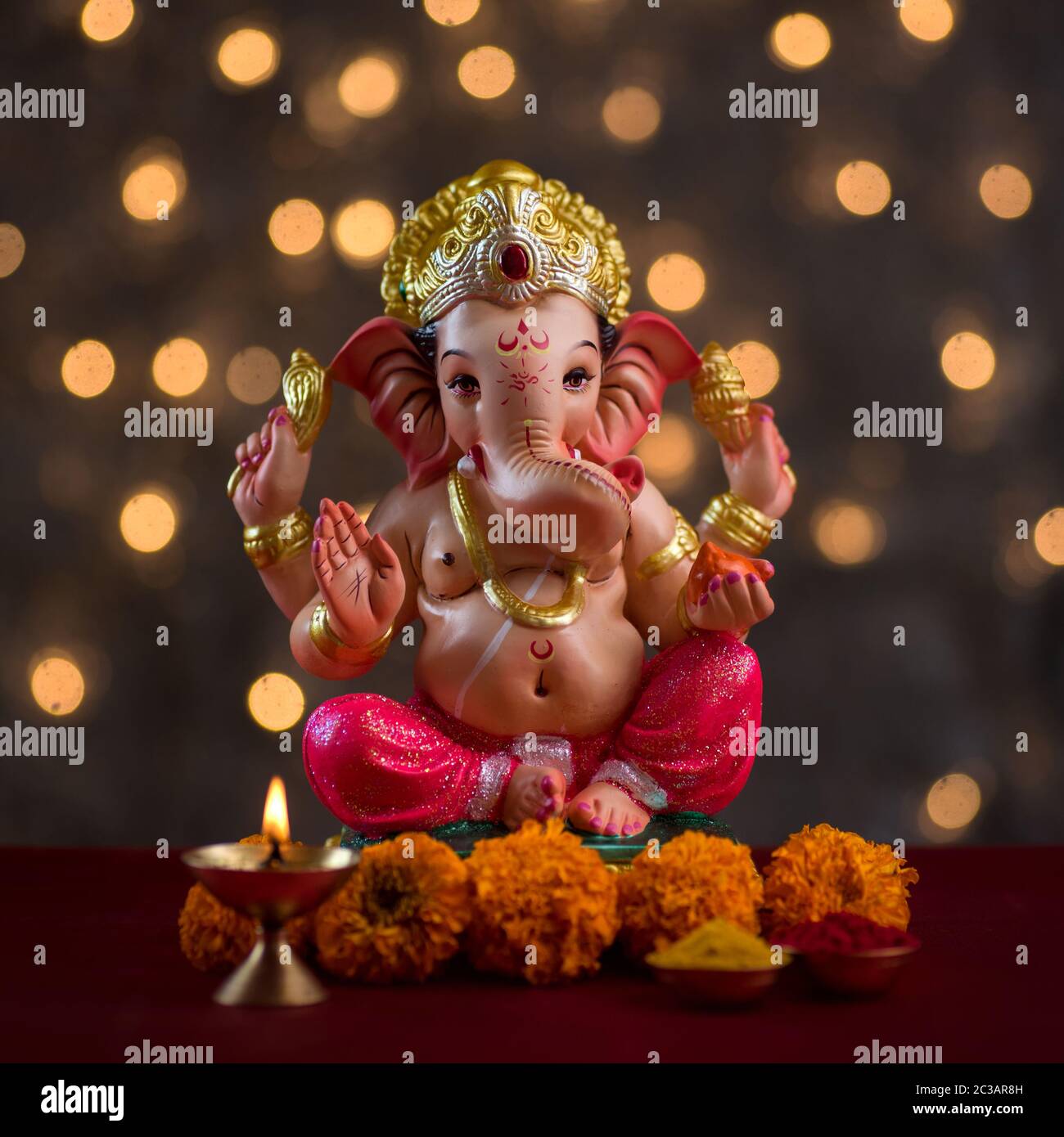 Hindu God Ganesha on Blured bokeh background, Ganesha Idol Stock Photo -  Alamy