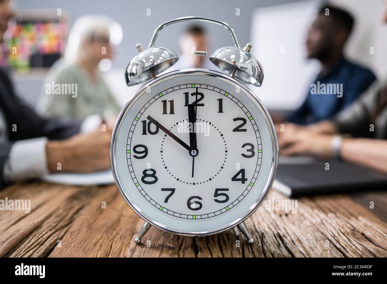 Diverse team in office clock hi-res stock photography and images - Alamy